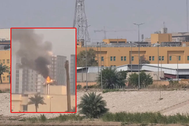 Smoke rising from the US embassy compound in Baghdad following missile strike