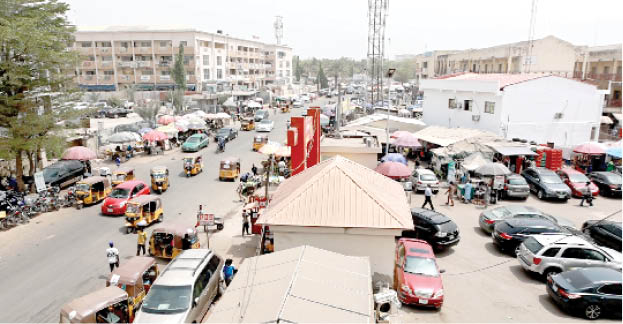 A busy market scene in Abuja illustrating congestion and safety concerns.