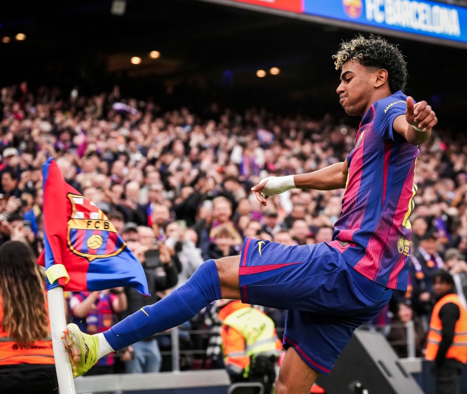 Lamine Yamal celebrating a goal for Barcelona during a match.