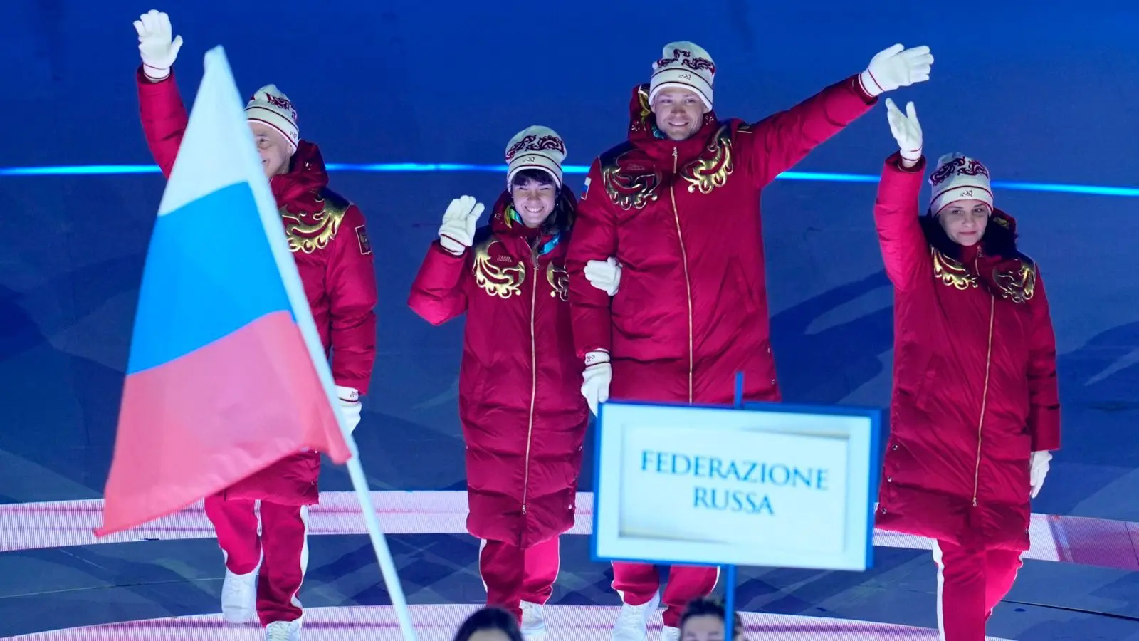 Russian athletes celebrating on the podium at the Milano Cortina 2026 Paralympics