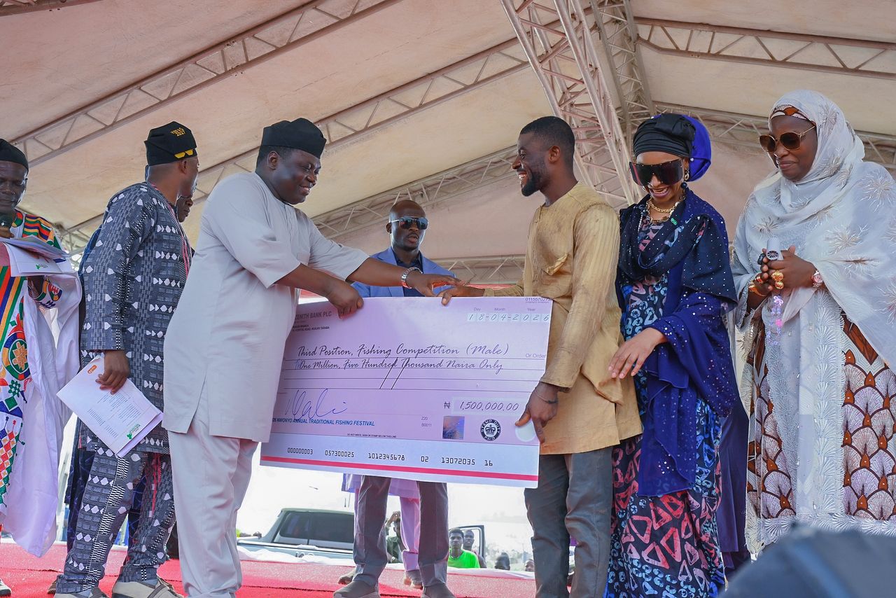 Participants at the Nwonyo fishing festival displaying their catches.