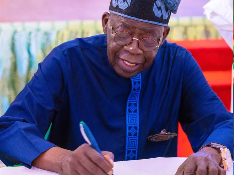 President Bola Tinubu signing the carbon market framework.