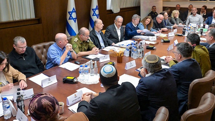 Israeli soldiers in the West Bank observing a settlement area.