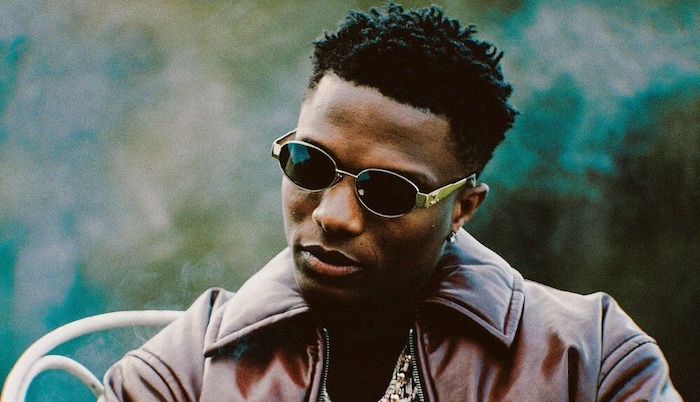 Wizkid performing live, celebrating his achievements as Africa's best-selling artist.