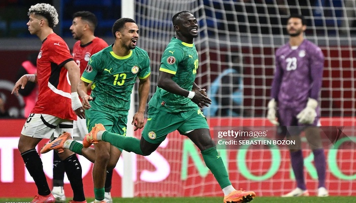 Sadio Mané celebrating after scoring the decisive goal for Senegal against Egypt.