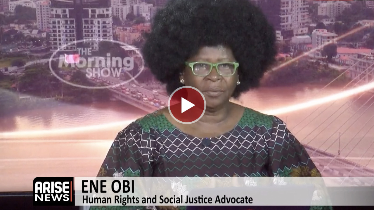 Human rights activist Ene Obi speaking at an event.