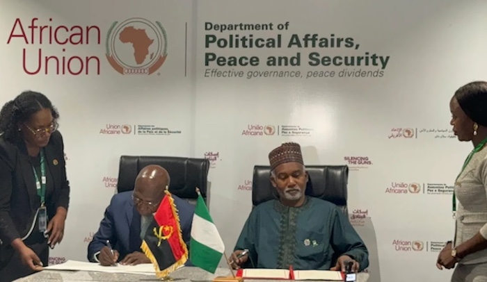 Nigeria and Angola officials signing the visa waiver agreement during the AU Summit.