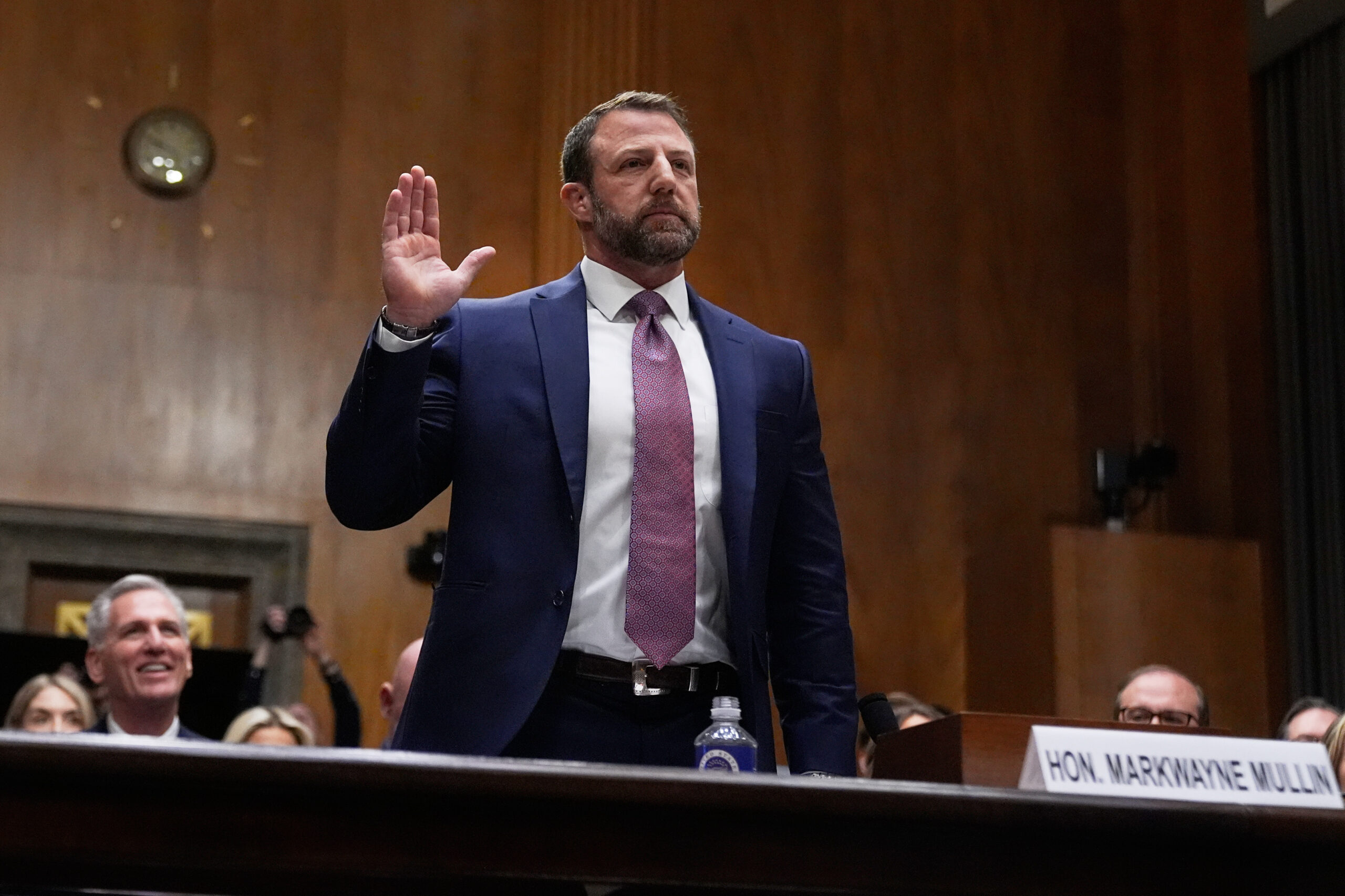 Senator Markwayne Mullin in a formal setting, possibly during a hearing.