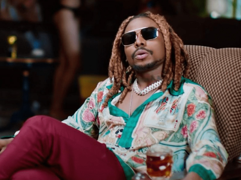 Asake performing at an event