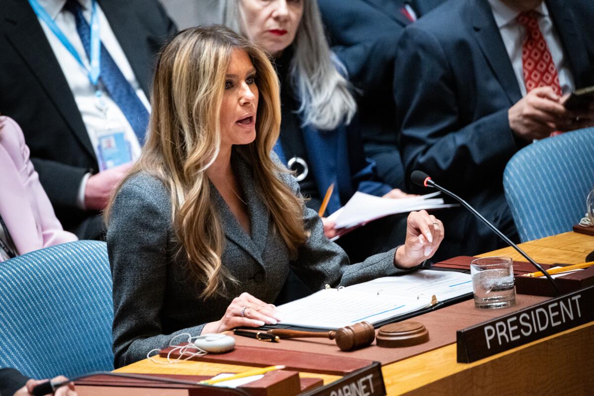 Melania Trump speaking at a podium during a UN Security Council meeting.