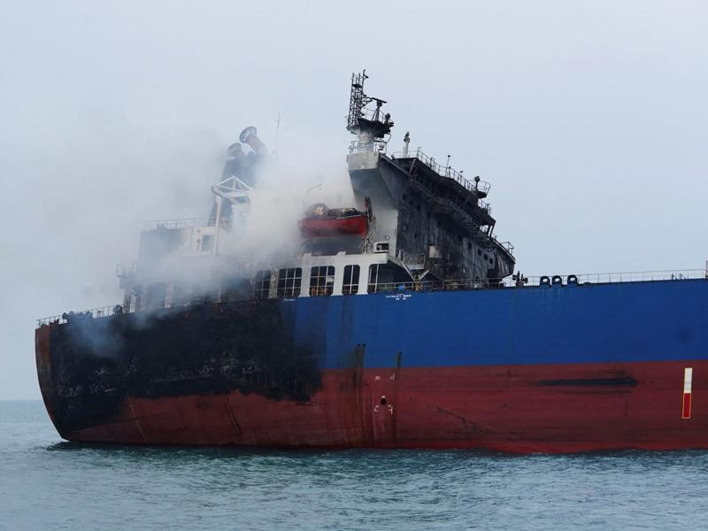 Oil tankers burning near Iraq, highlighting the escalating tensions in the region