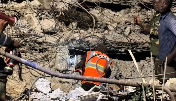 Emergency responders at the site of the building collapse in Accra, Ghana.