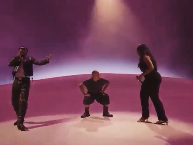 Justin Bieber, Wizkid, and Tems performing together on stage at Coachella.