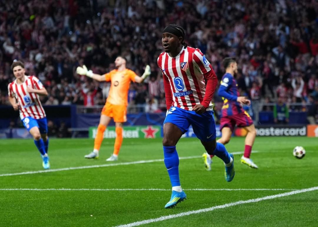 Atletico Madrid players celebrating a goal during a Champions League match.