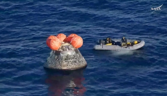 The Artemis II crew returns to Earth in their Orion capsule after a historic mission around the Moon.