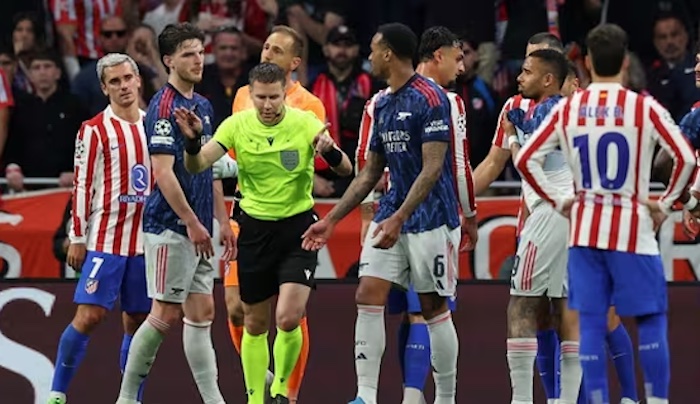 Atletico Madrid and Arsenal players in action during their Champions League semi-final first leg match.