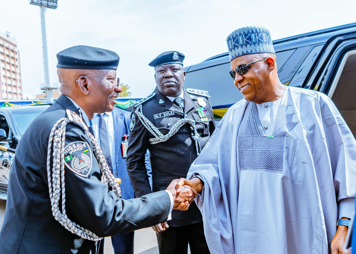 Inspector General of Police Olatunji Disu and Vice President Kashim Shettima at the National Police Day celebration.