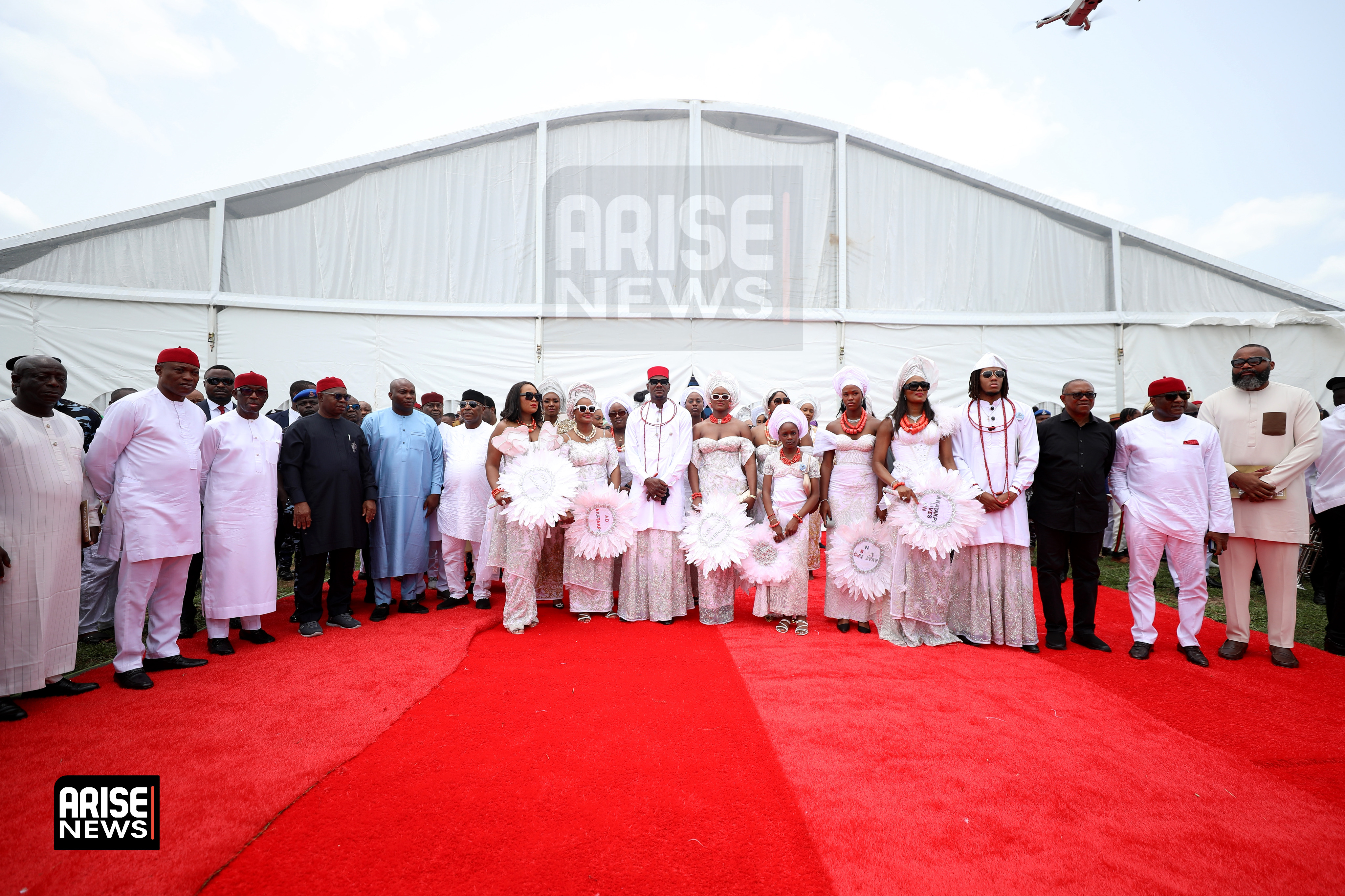 A group of family and guests gathered after the funeral service for Chief Matthew Egwuenu.
