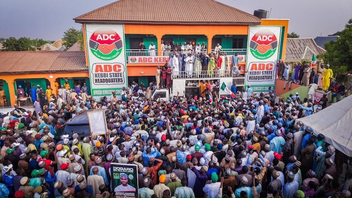 Abubakar Malami waving to a large crowd of supporters during his homecoming rally in Kebbi State.