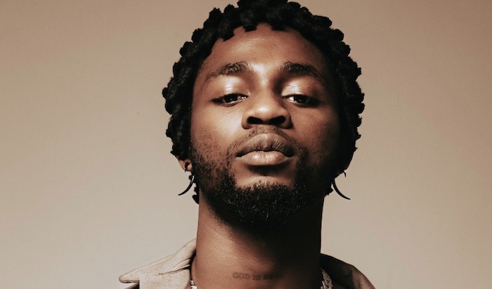 Nigerian artist Omah Lay posing for a picture.