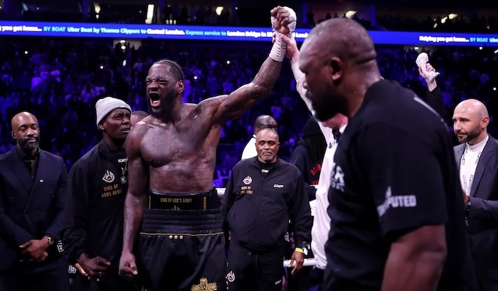 Deontay Wilder and Derek Chisora during their heavyweight boxing match in London.