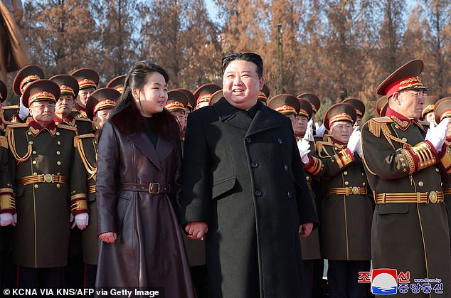 Kim Jong Un with his daughter Ju Ae at an official event