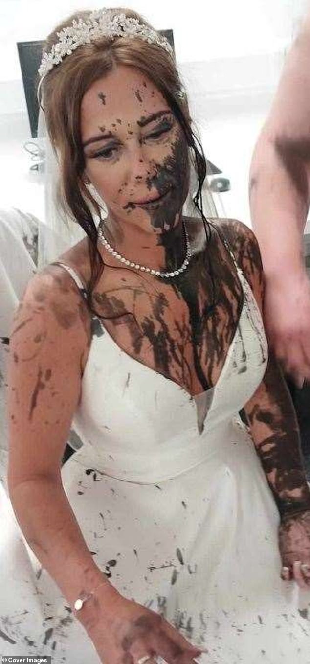 Close-up of bride Gemma Monk, visibly upset and with black paint on her face and dress.