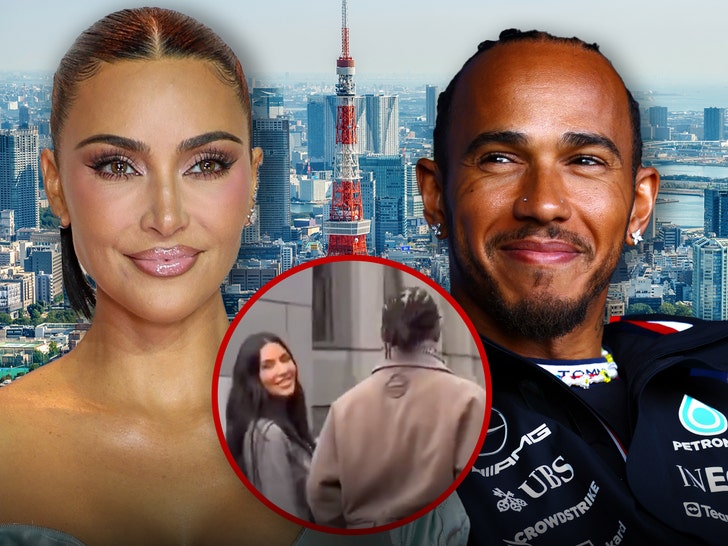 Kim Kardashian and Lewis Hamilton at a Tokyo event, enjoying each other's company.