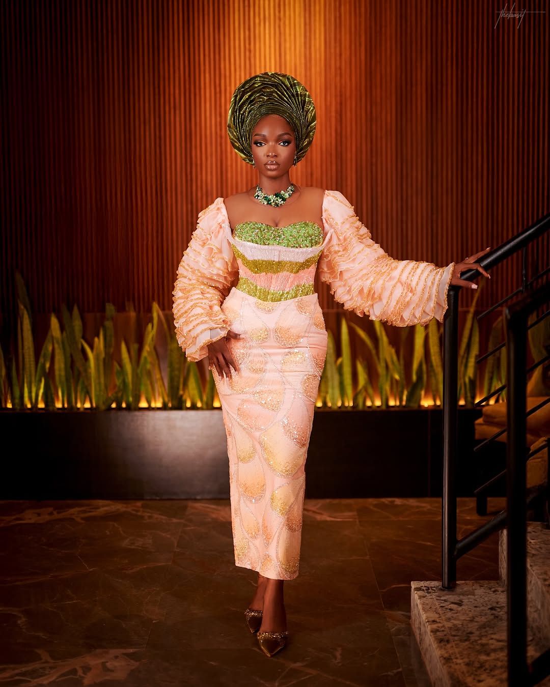 Detailed view of the intricate beadwork on a peach Yoruba bridal dress