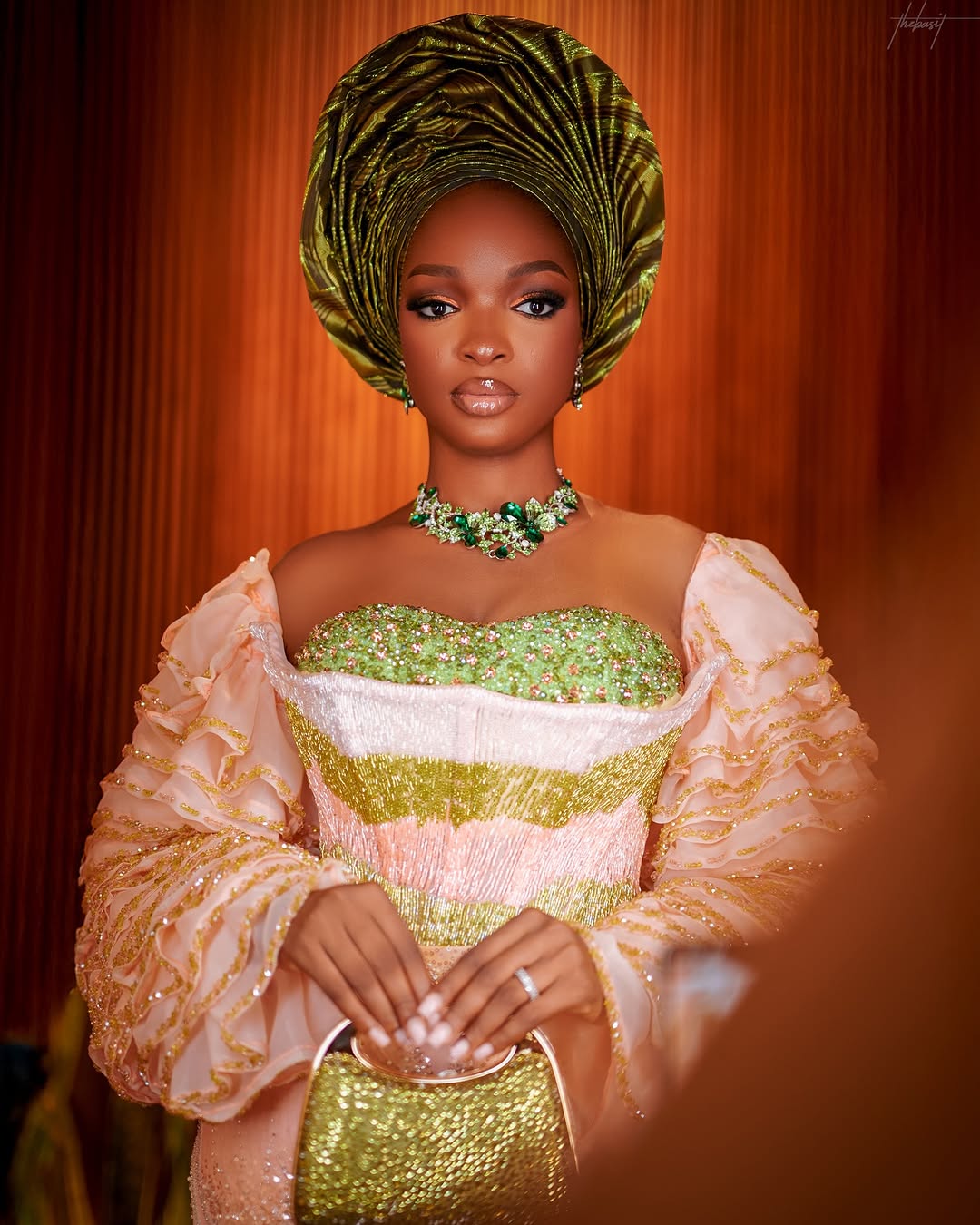 Peach Yoruba traditional bridal look with beaded bodice and ruffled sleeves