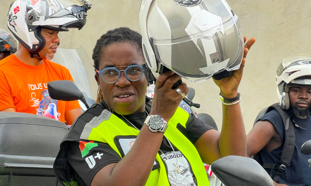 Bamba Édith Christine riding her motorcycle in Cocody, Ivory Coast.