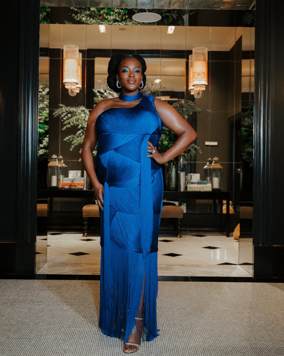 Wunmi Mosaku at the 2026 BAFTA Awards wearing a royal blue gown.
