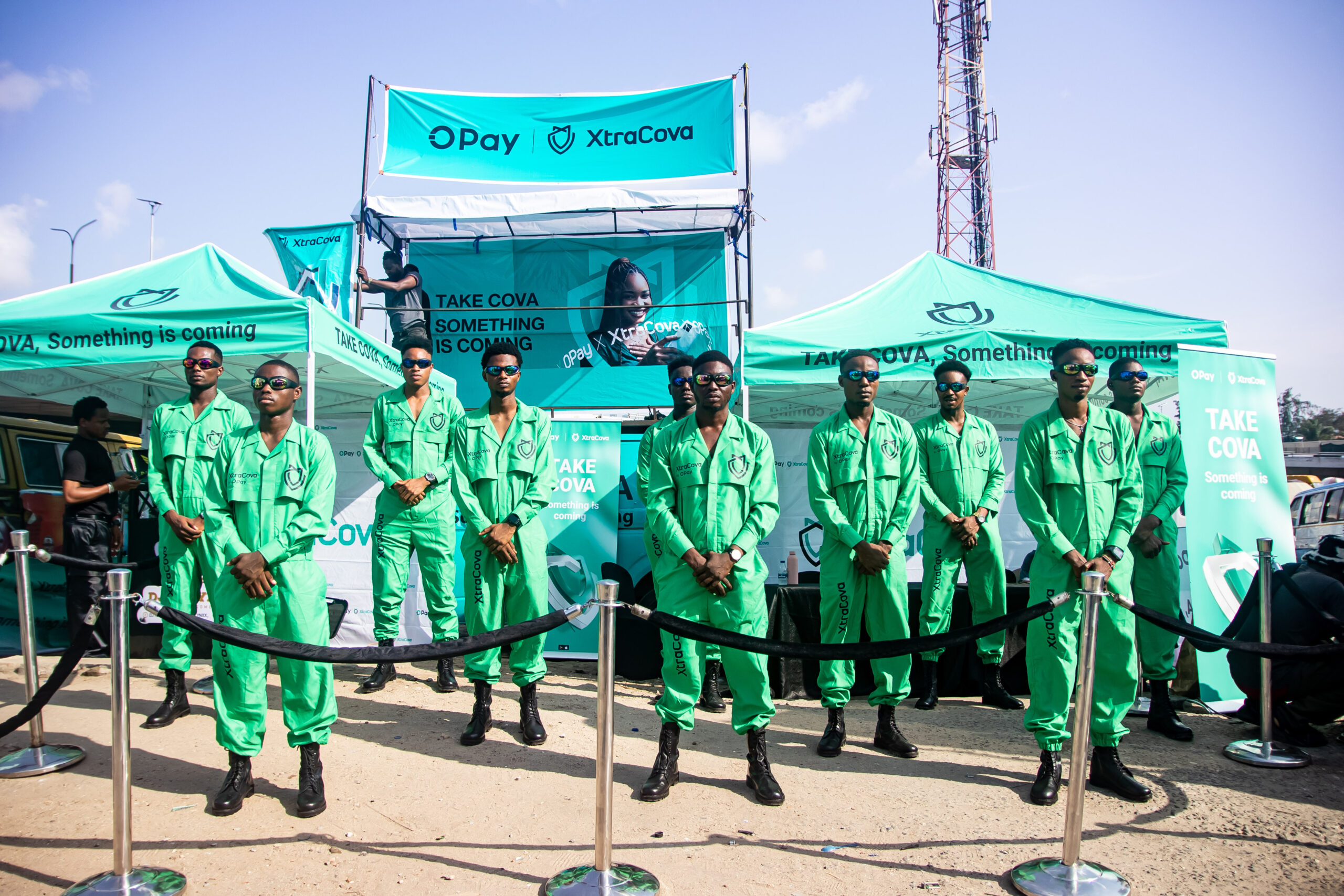 OPay branded green installation set up in a public space.