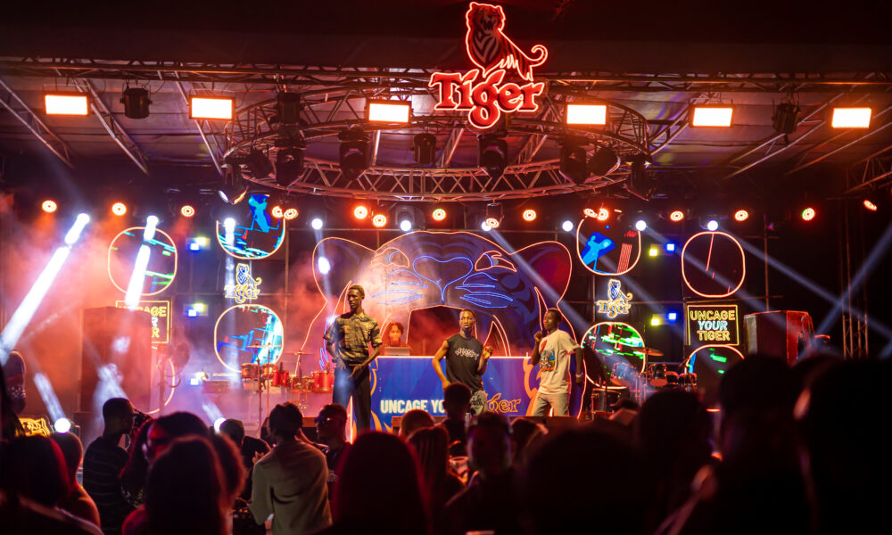 A lively street party scene featuring vibrant decorations and attendees enjoying themselves
