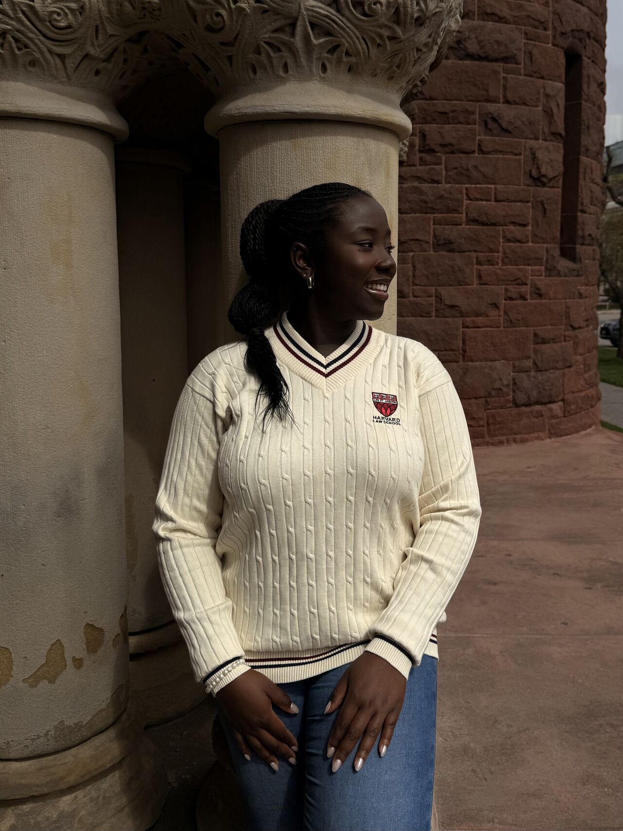 Ifeanyi Ruth Umunna in a thoughtful pose inside Harvard University's Memorial Hall during her transition into law studies.