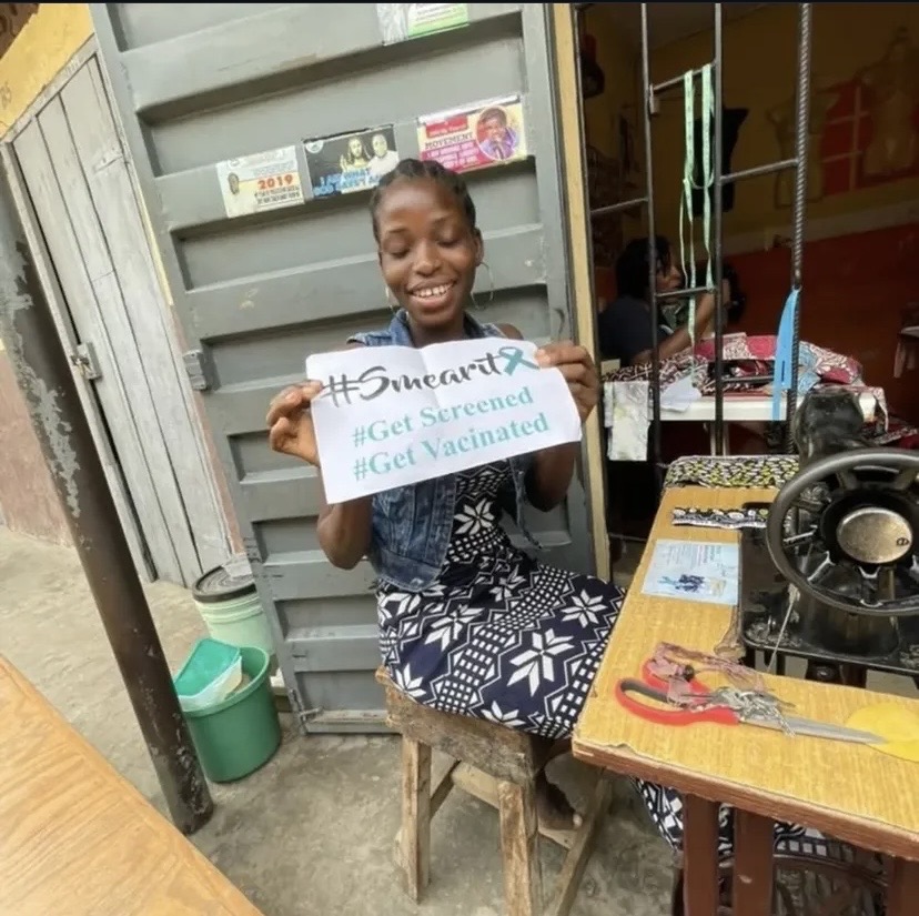 A group of women participating in the #SMEARIT campaign, some with lipstick smeared on their faces.