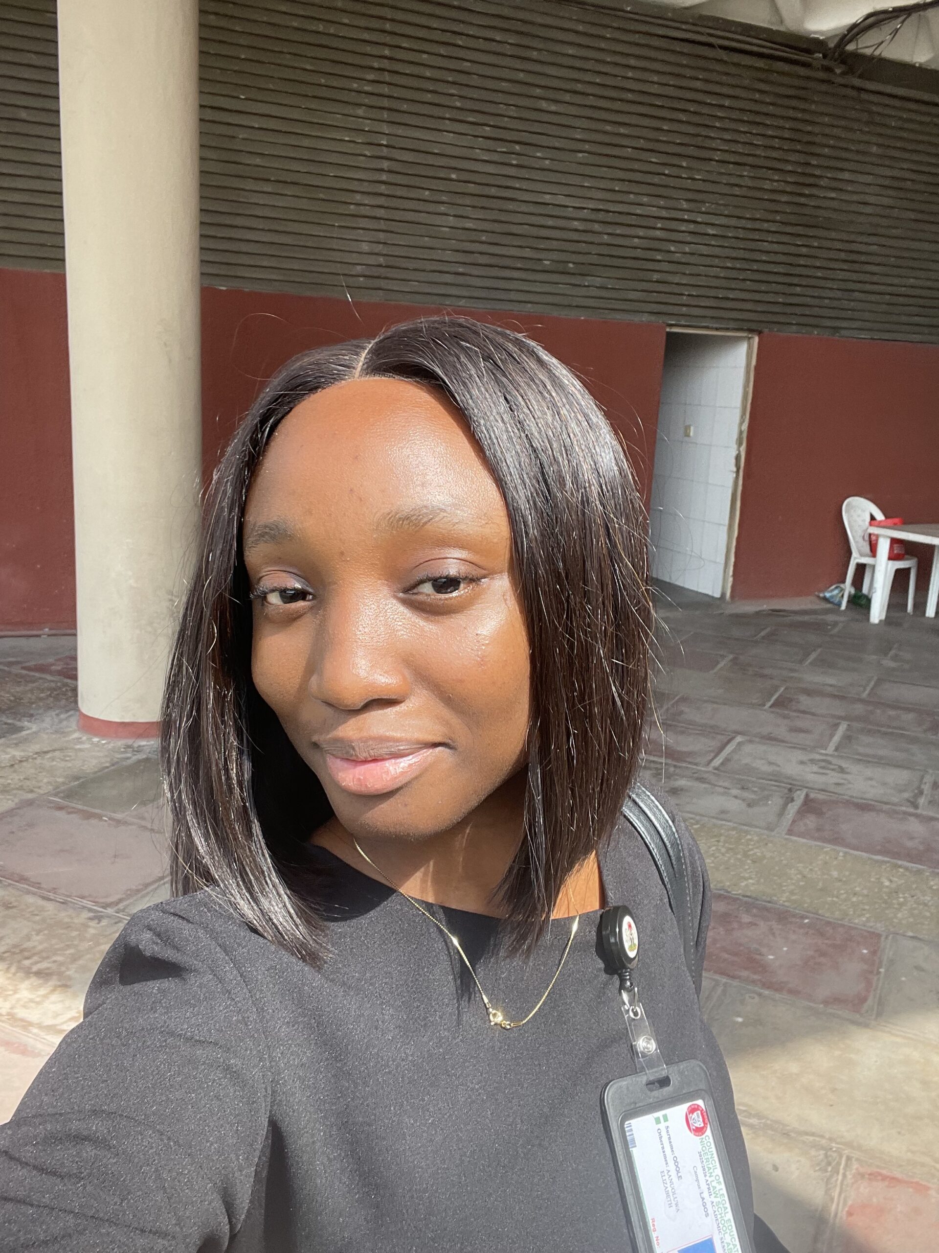 Aanuoluwa Odole smiling in academic attire.