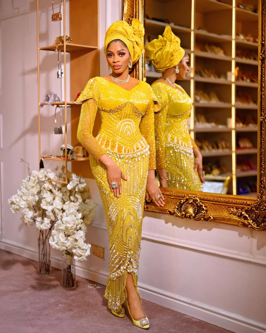 Shade Okoya poses in a golden yellow embellished gown and matching gele for her 49th birthday photoshoot.