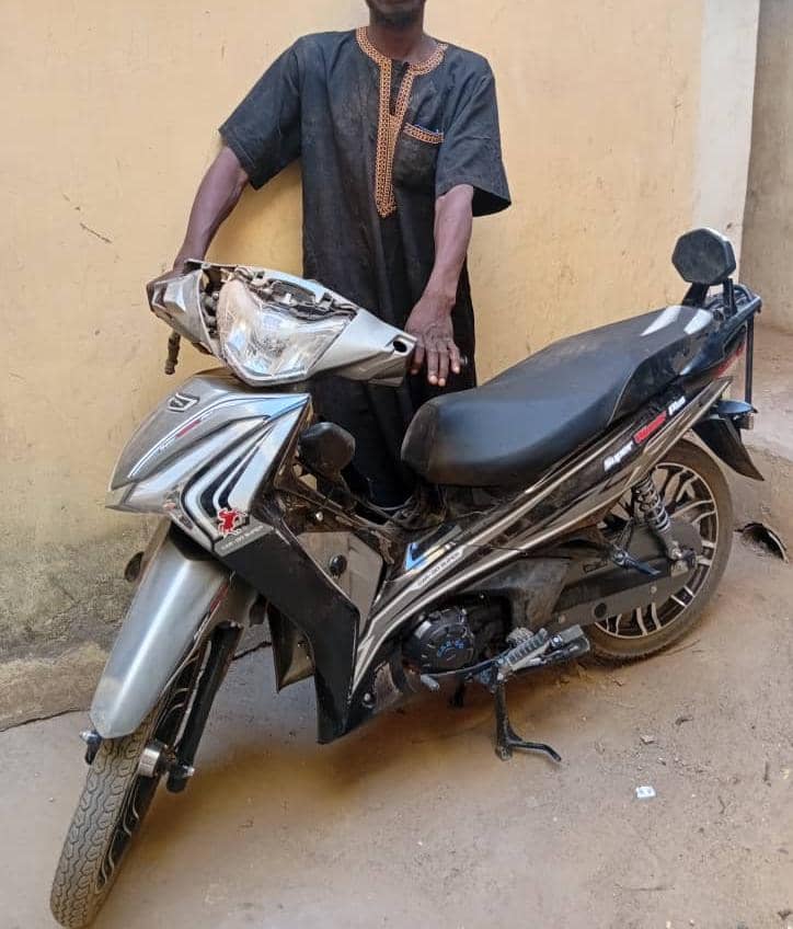 Police apprehending a motorcycle theft suspect in Yobe