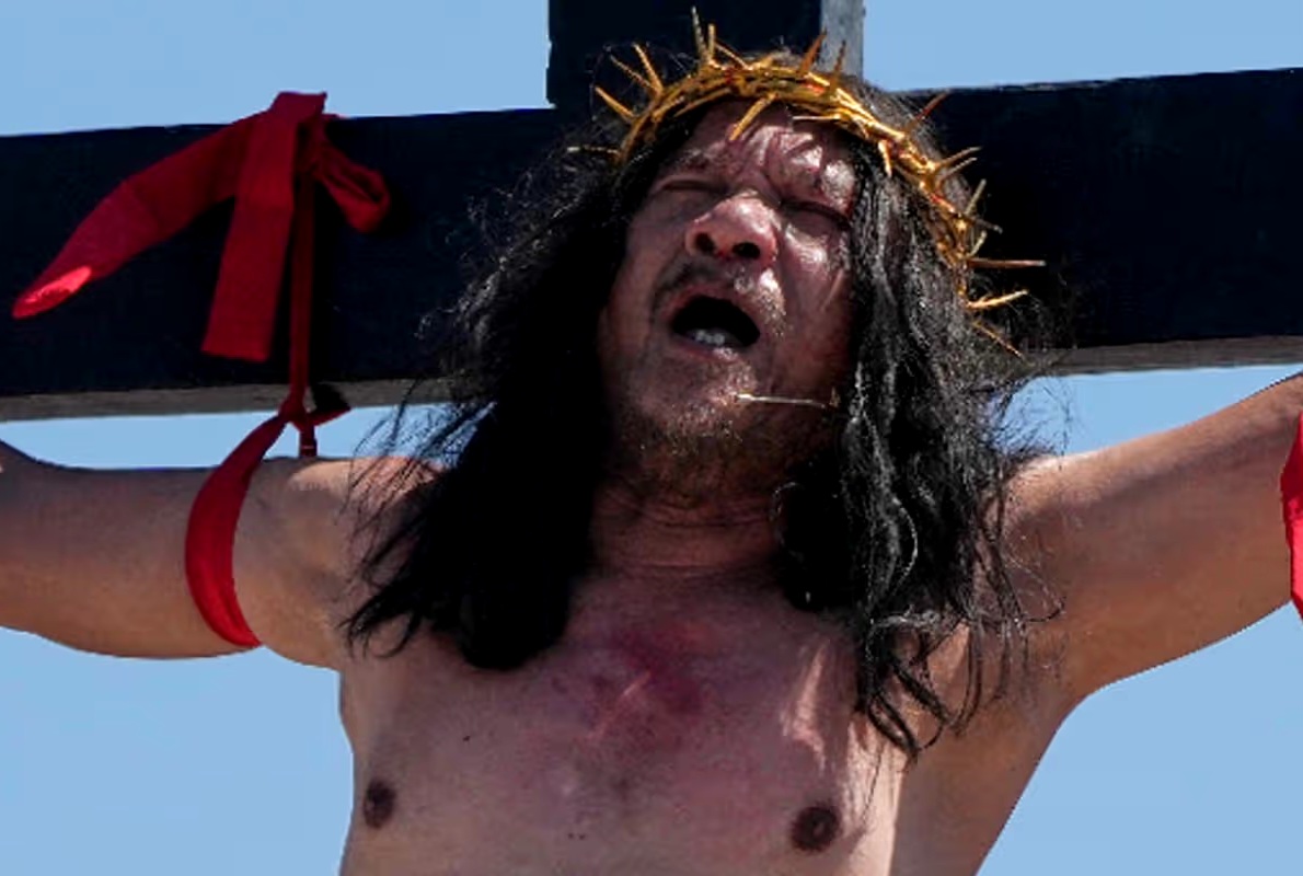 Ruben Enaje being nailed to a cross during a Good Friday reenactment.