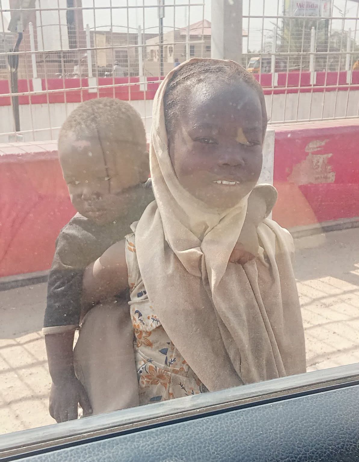Kano resident Zafrullah Abdulaziz observing children scavenging for food