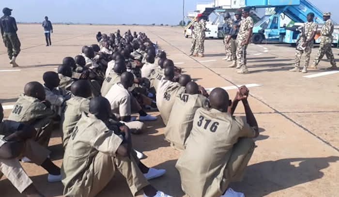 A group of former insurgents graduating from the rehabilitation programme in Borno