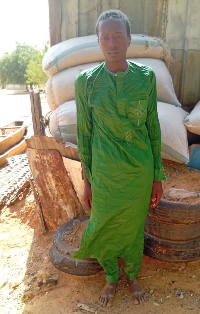 Troops arresting a suspected ISWAP informant in Yobe State