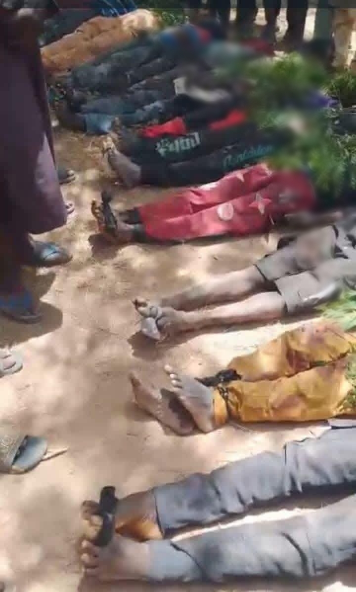 Local residents gather in mourning after the attack in Katsina