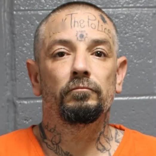 Mugshot of Joe Green, a man with a tattoo saying 'f**k the police' on his forehead