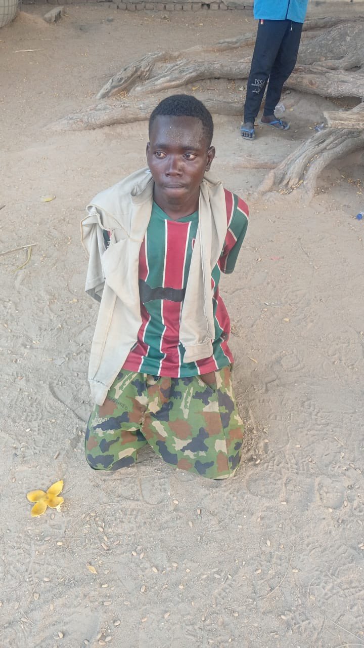 Troops arresting a suspected Boko Haram member attempting to infiltrate Maiduguri
