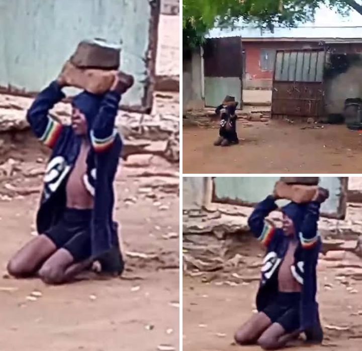 A young girl struggling to hold two heavy stones above her head