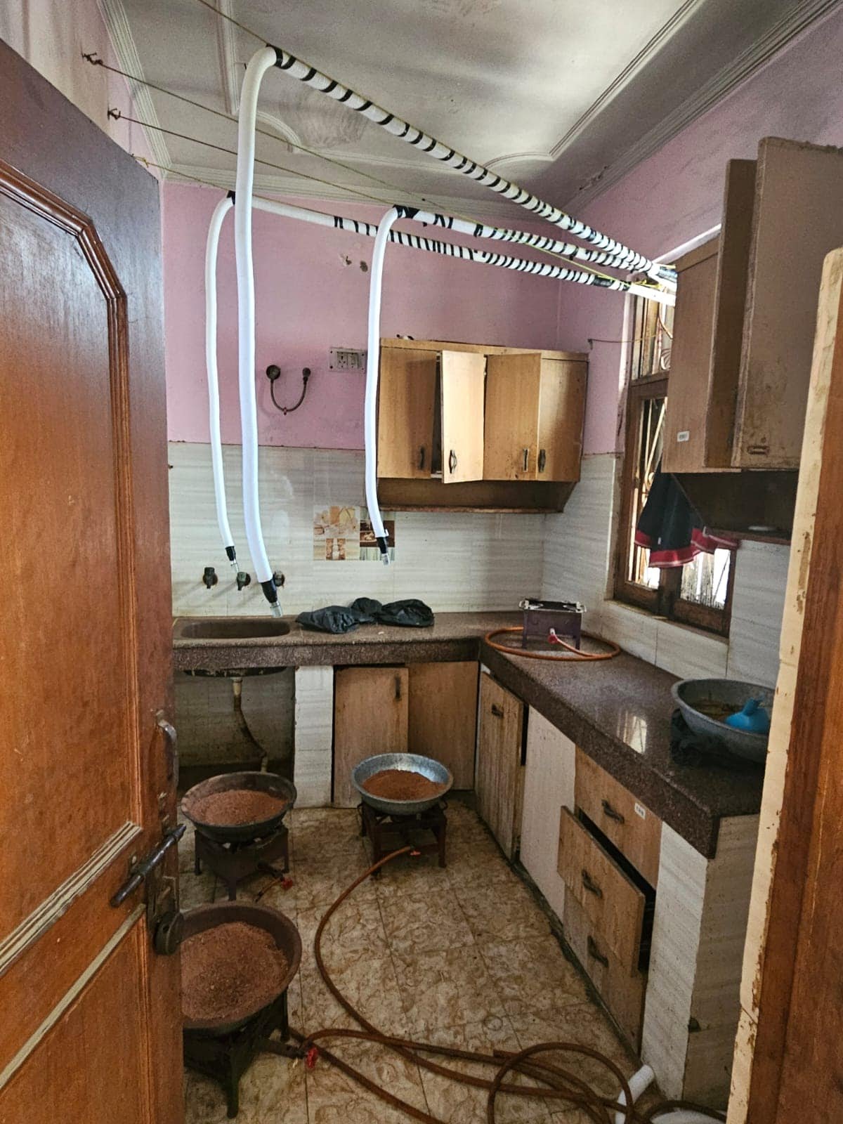 Officials at the scene of the drug factory bust