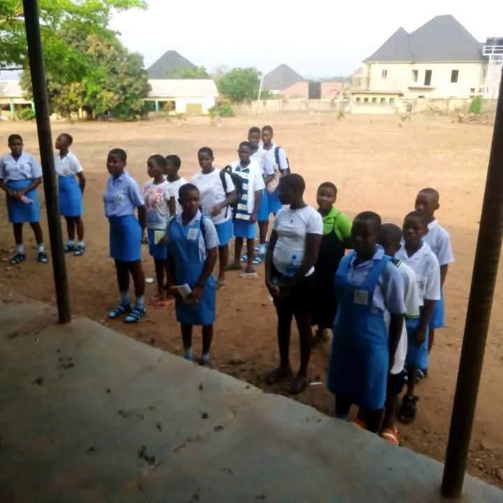 A classroom with very few students present, illustrating low attendance at Anambra schools.