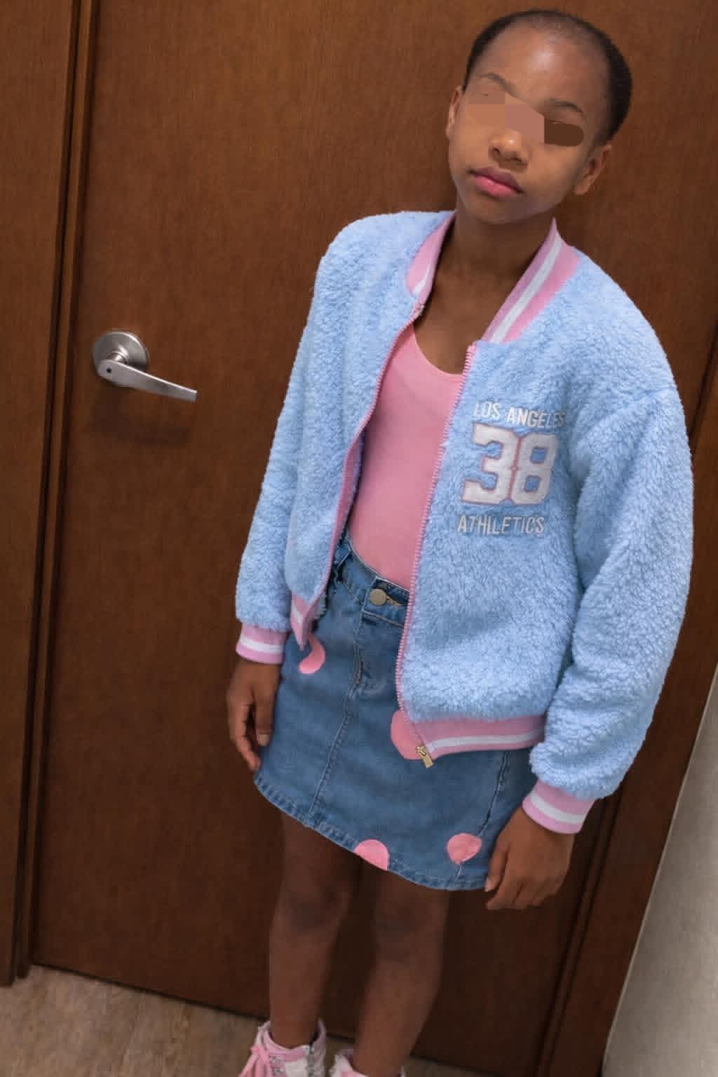 Kierra Williams's daughter showing her new haircut after being shaved.